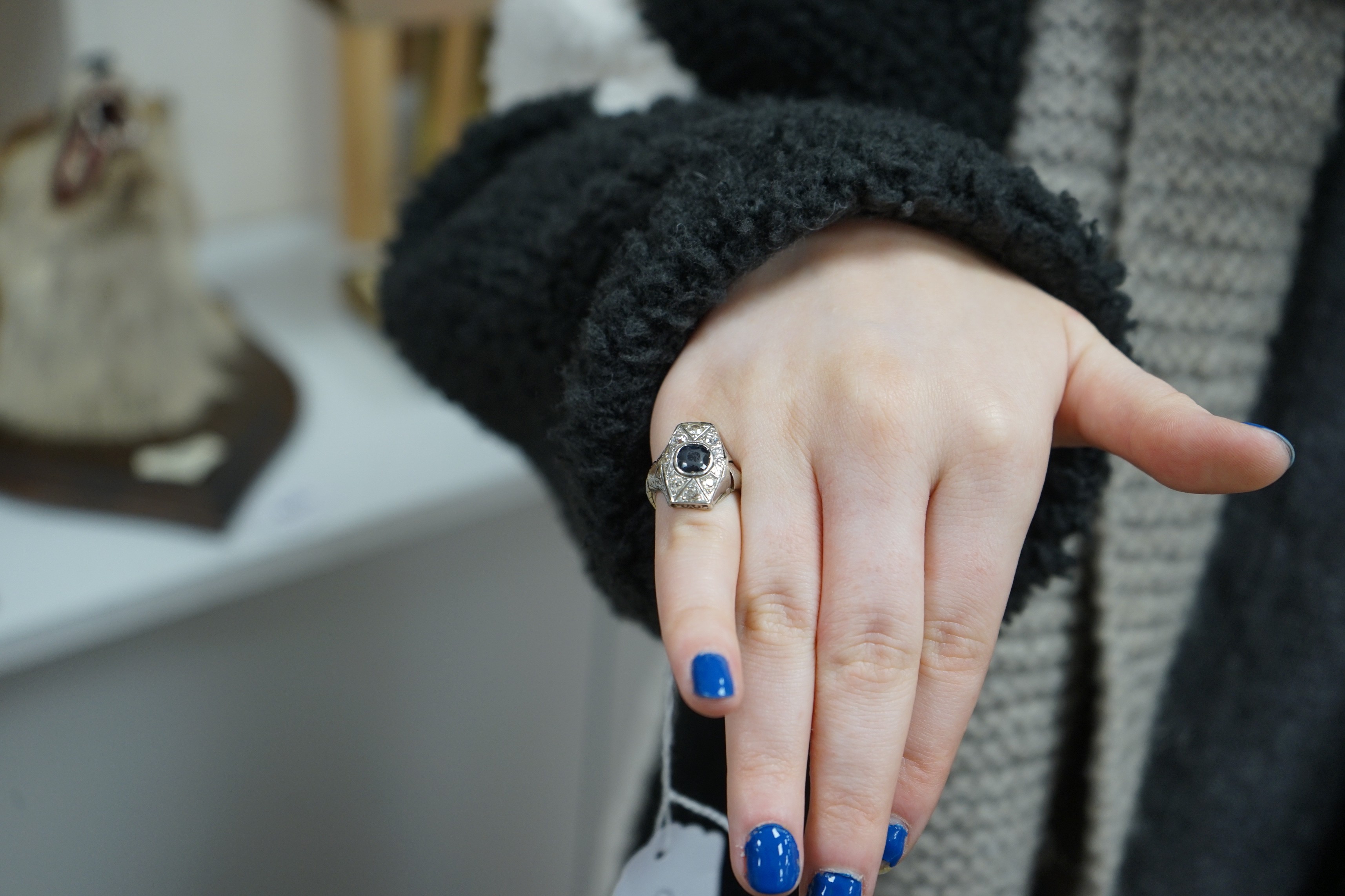 A 1940's? white metal, sapphire and diamond cluster set hexagonal dress ring, size L, gross weight 4.6 grams.